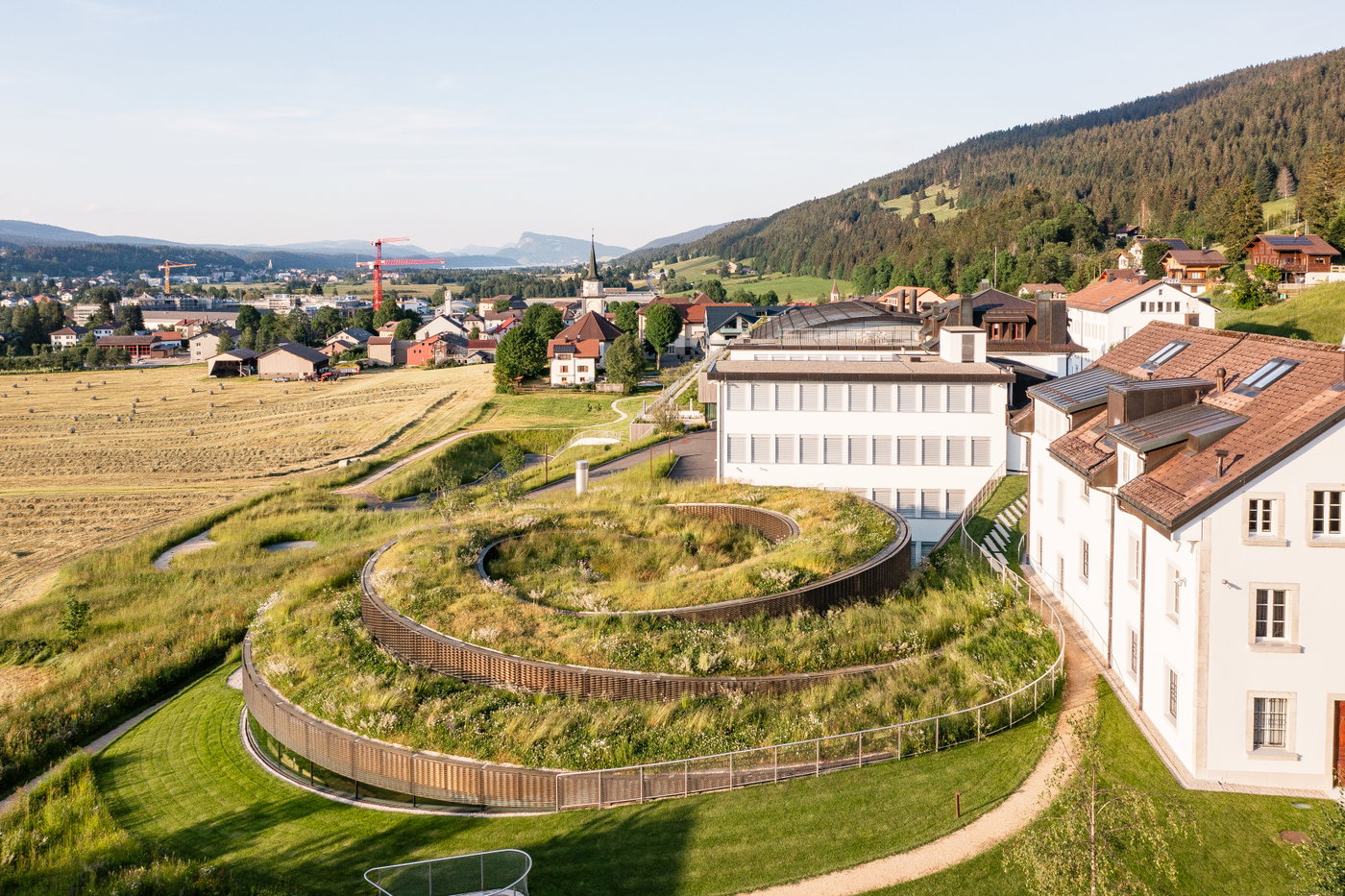 THE AUSTRALIAN SPOTLIGHTS MUSÉE ATELIER AUDEMARS PIGUET AND HÔTEL DES HORLOGERS | Bjarke Ingels Group